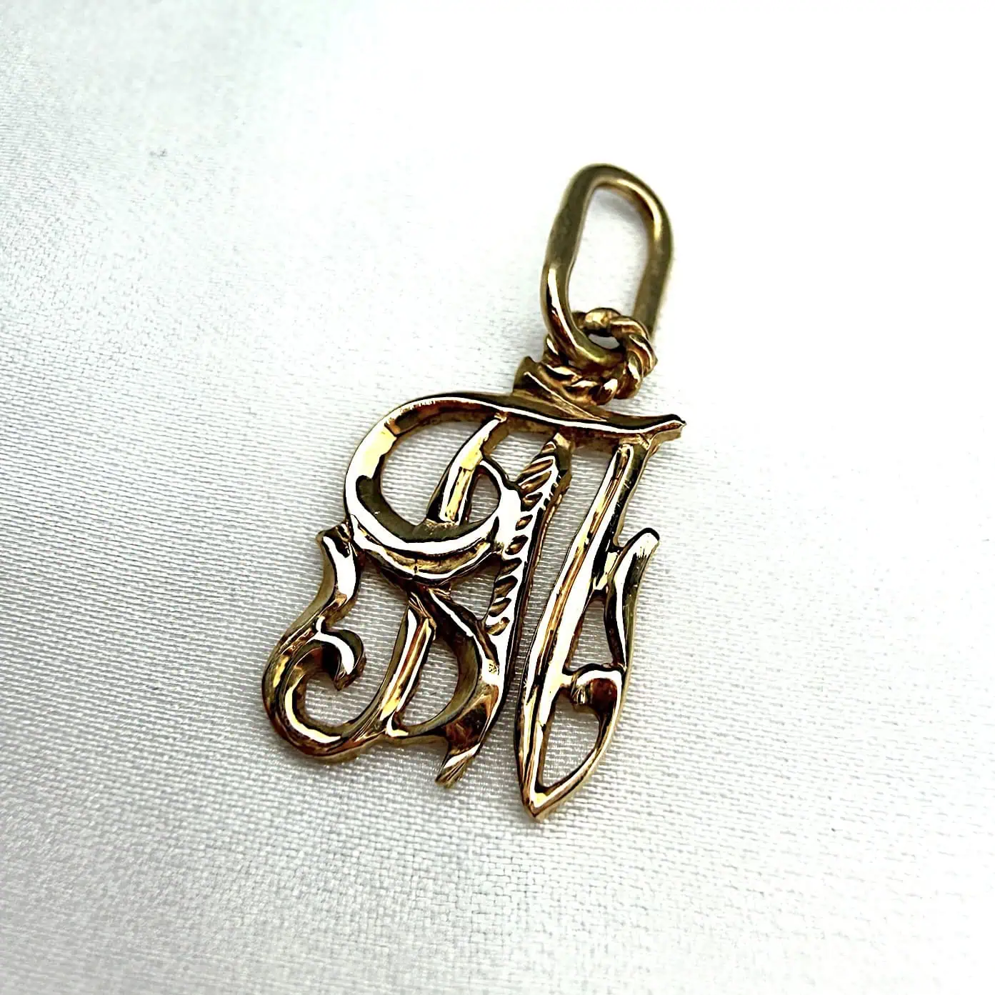 Золотий підвіс "Ажурна буква "Т" фото