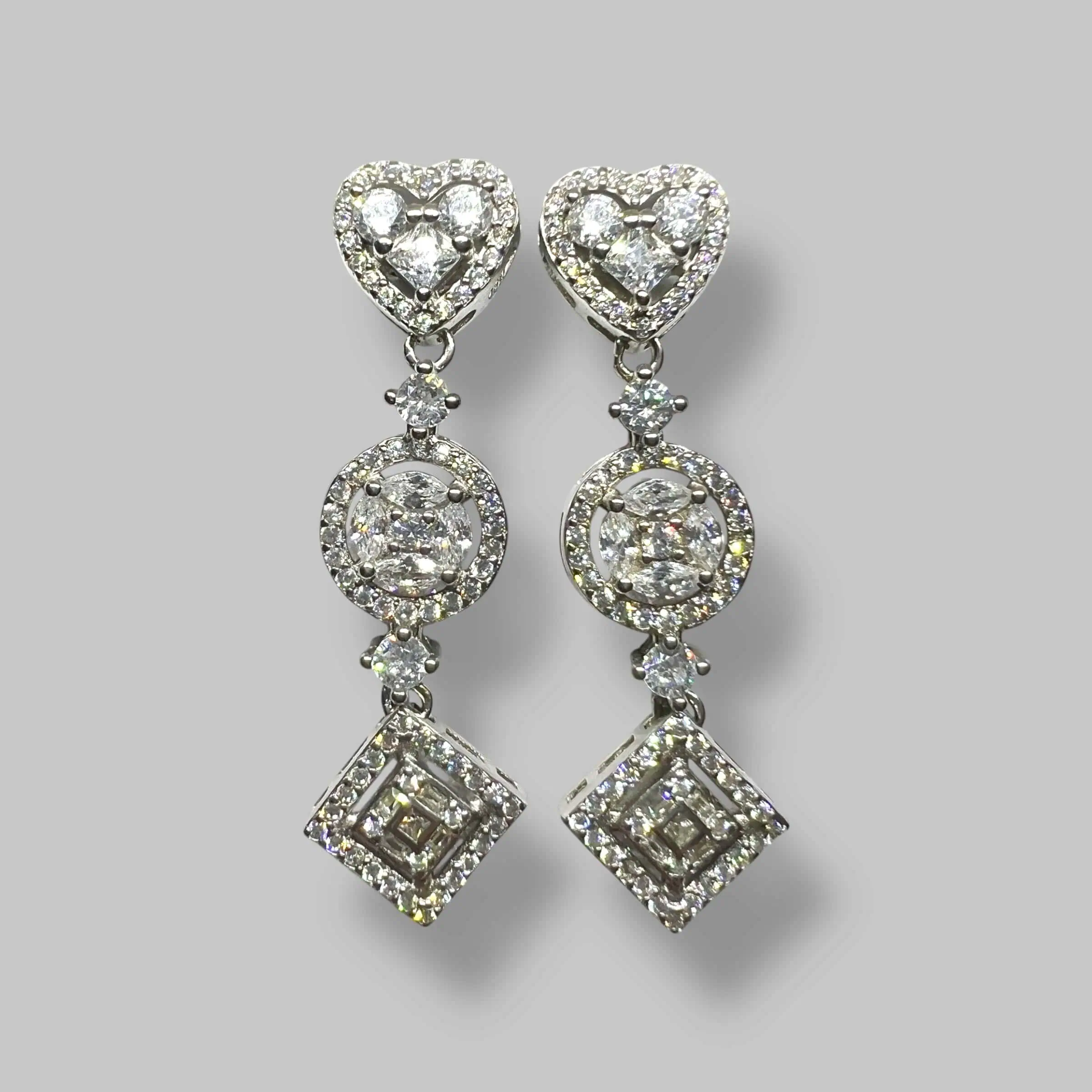 Срібні сережки "Тріада сяйва" фото