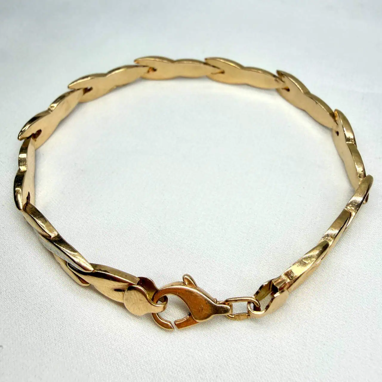 Золотий браслет "Коса-краса" фото