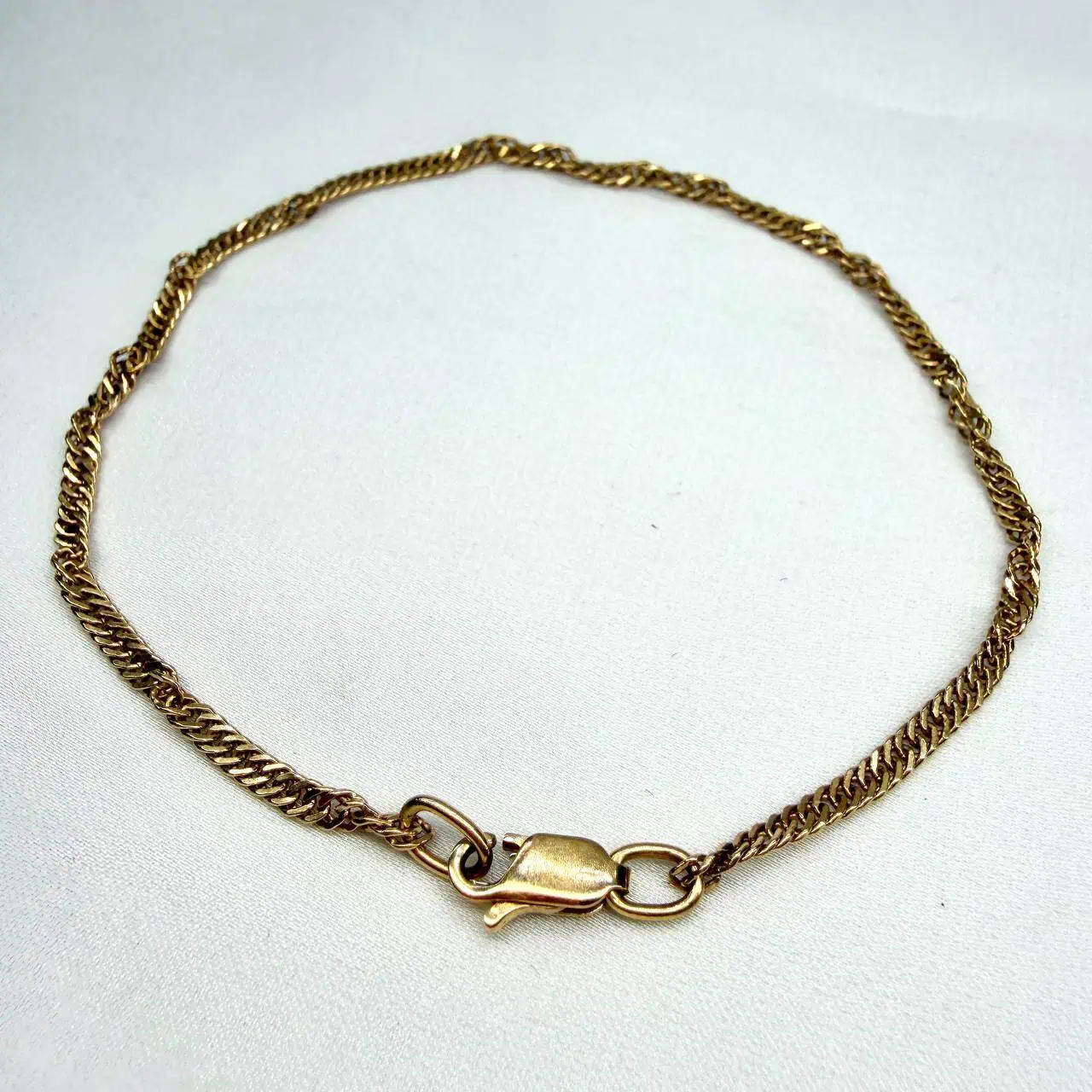 Золотий браслет "Спіраль на зап`ястку" фото